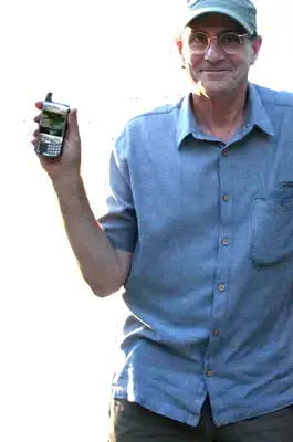 James at Home Showing Off His New Blackberry; Photo by Paul Zollo